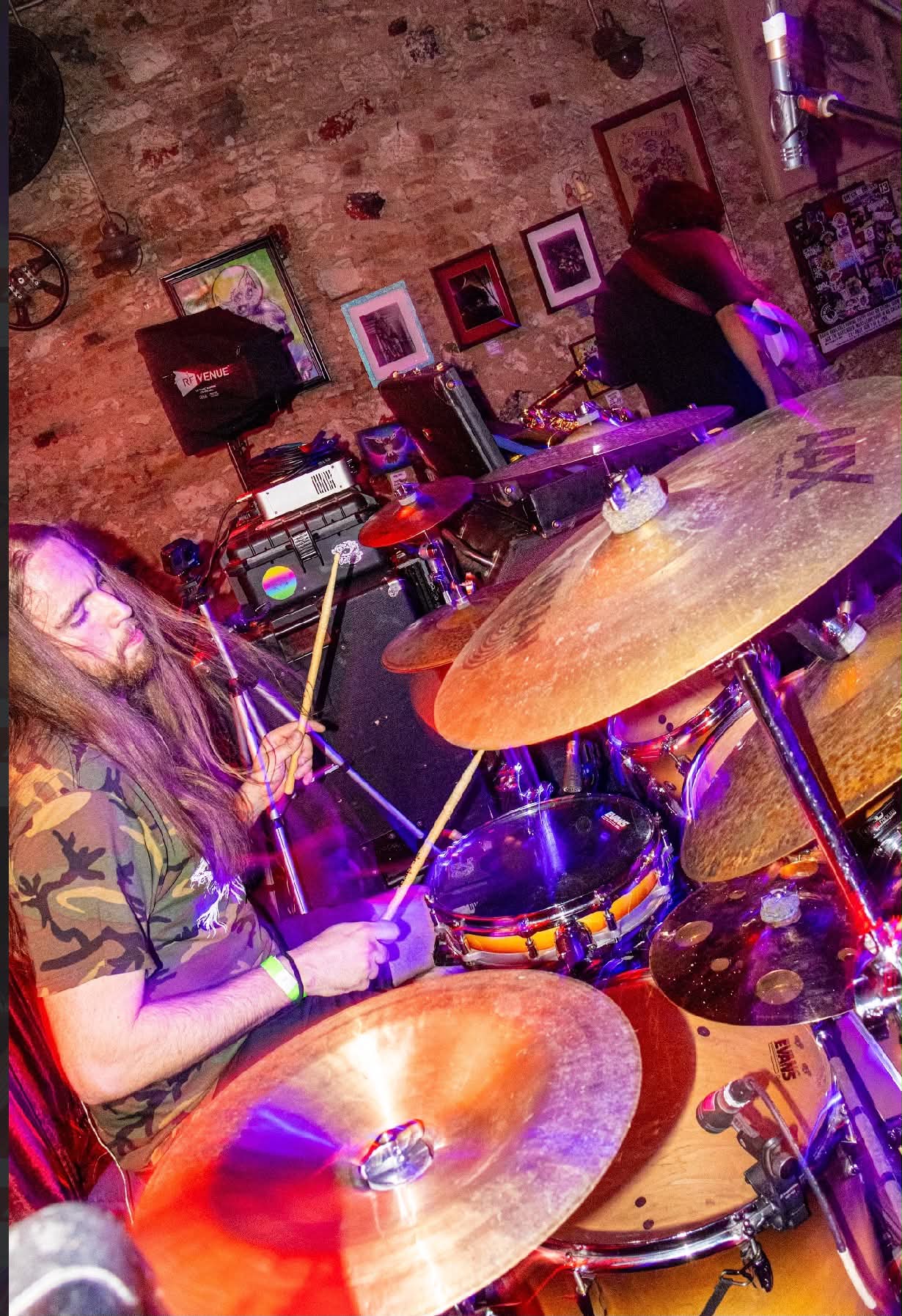 Brady Mayo playing drums on stage